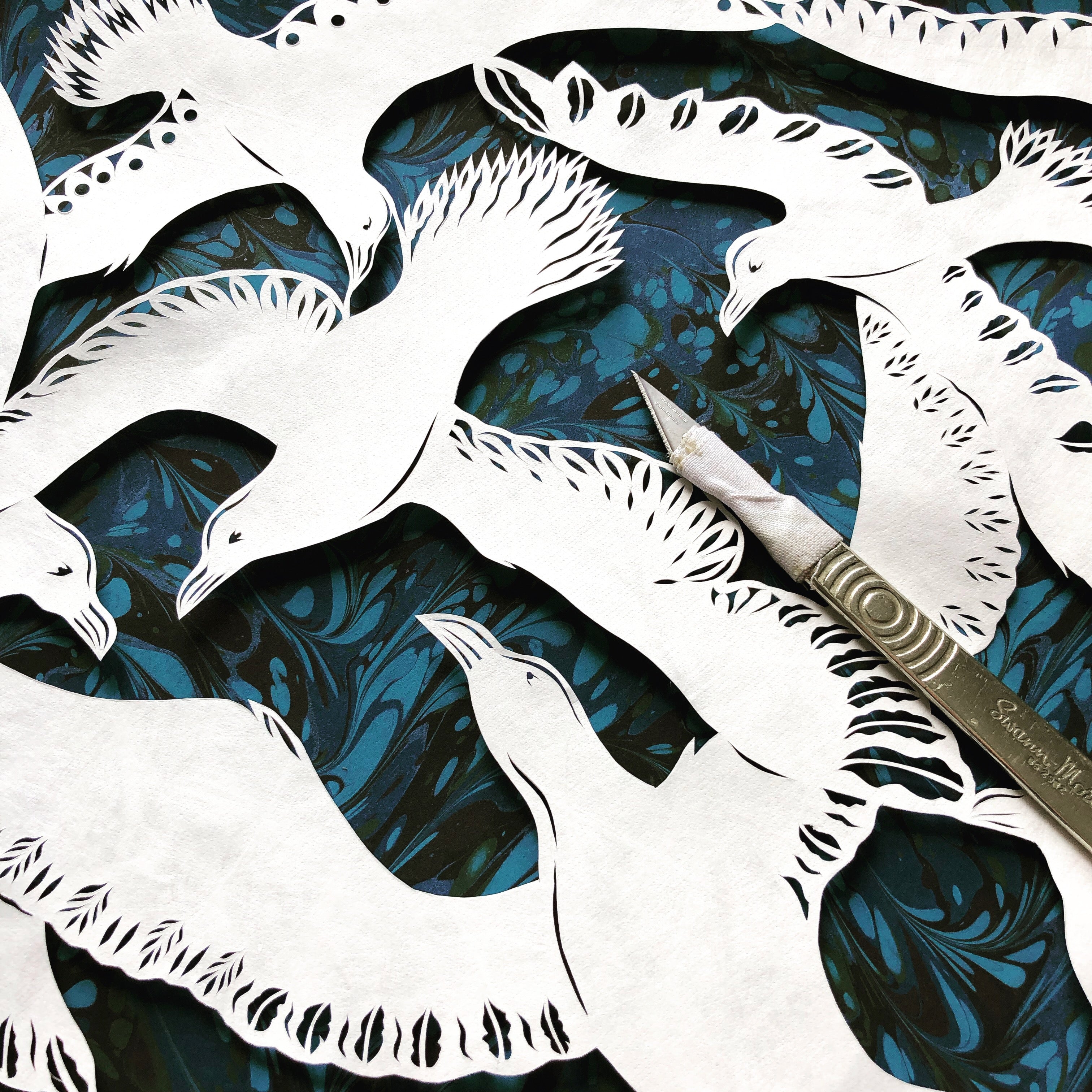 Jess with a paper cuts piece.